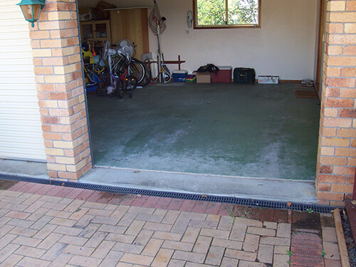 Garage floor worn out and neglected.