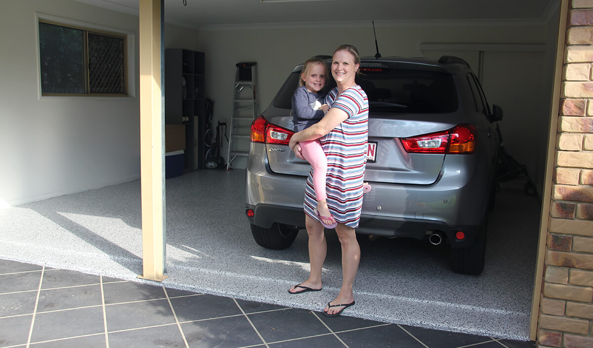 Happy homeowner with finished Garage Granite floor.