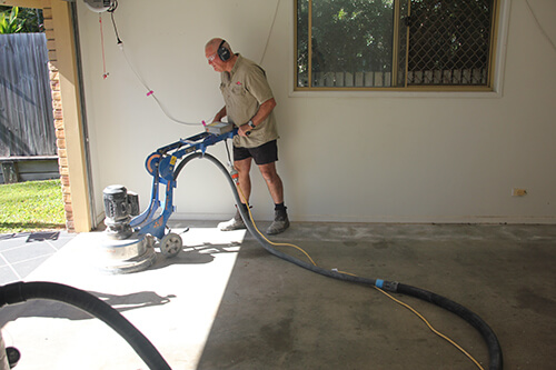 Professional installation of Garage Granite on garage floor.