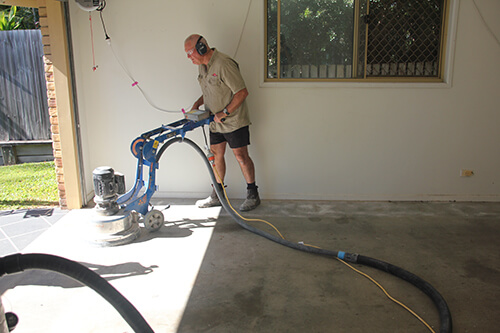 Professional installation of Resin Vinyl on garage floor.